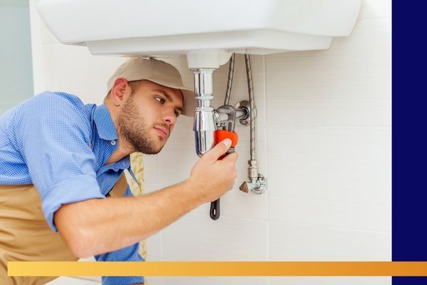 handyman fixing plumbing