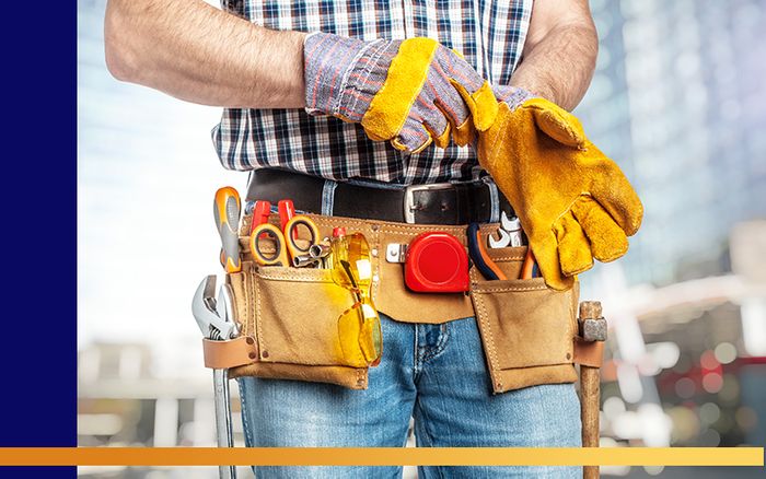 image of a handyman putting on gloves