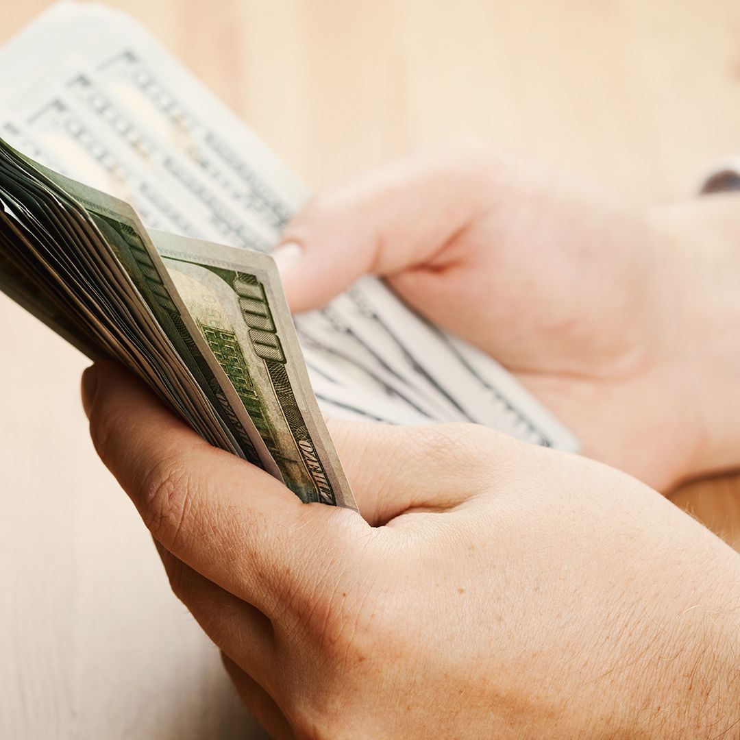 Image of a person counting money