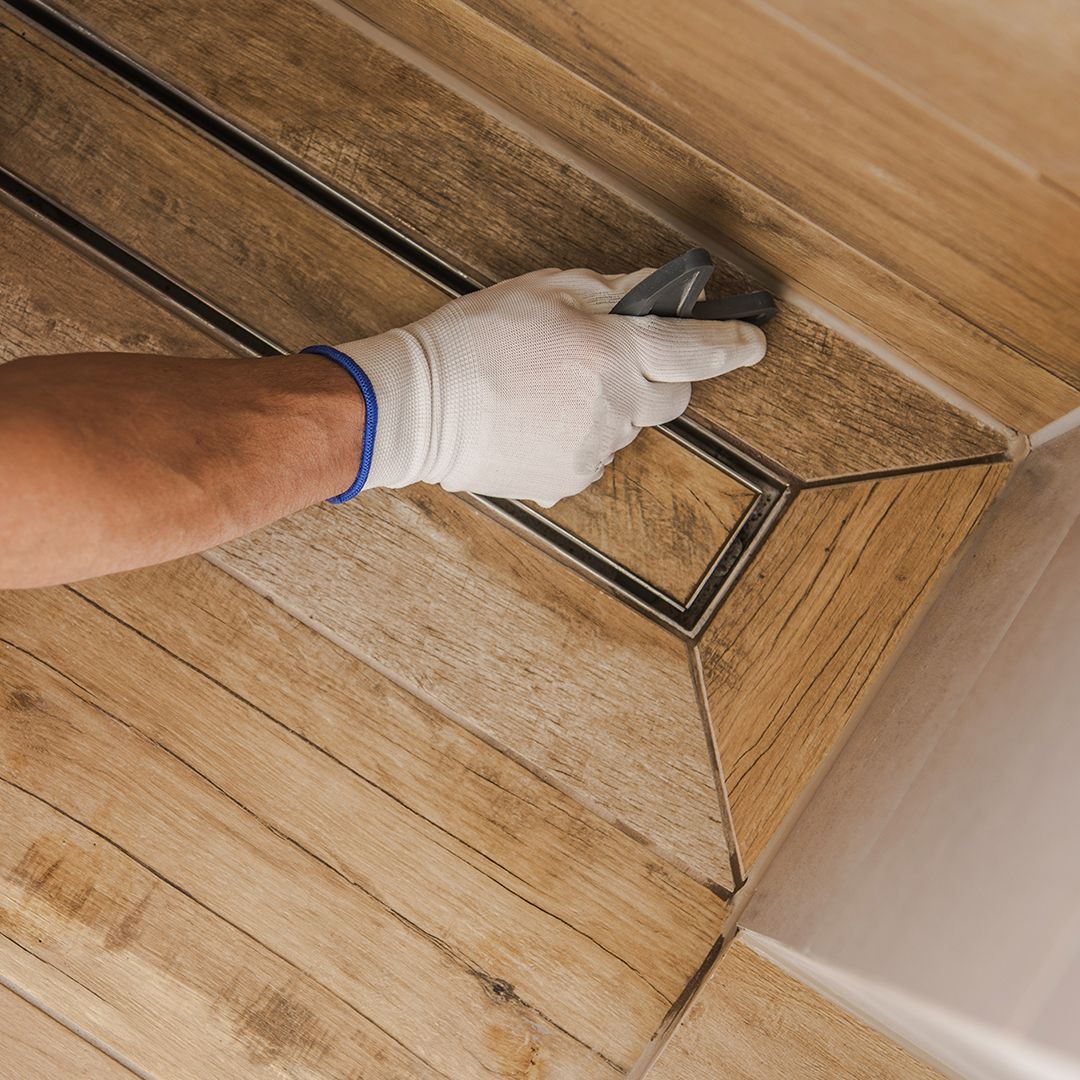 Image of a handyman installing wooden paneling