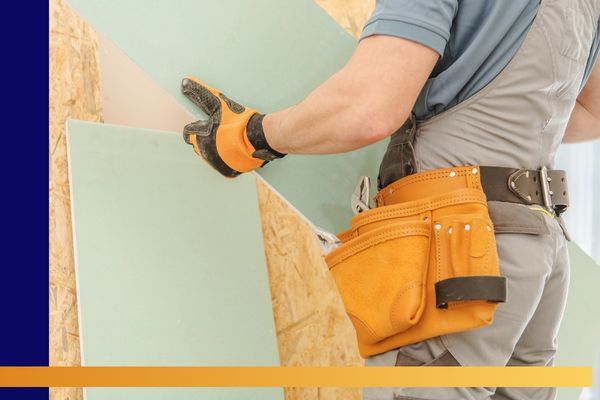 man working on drywall