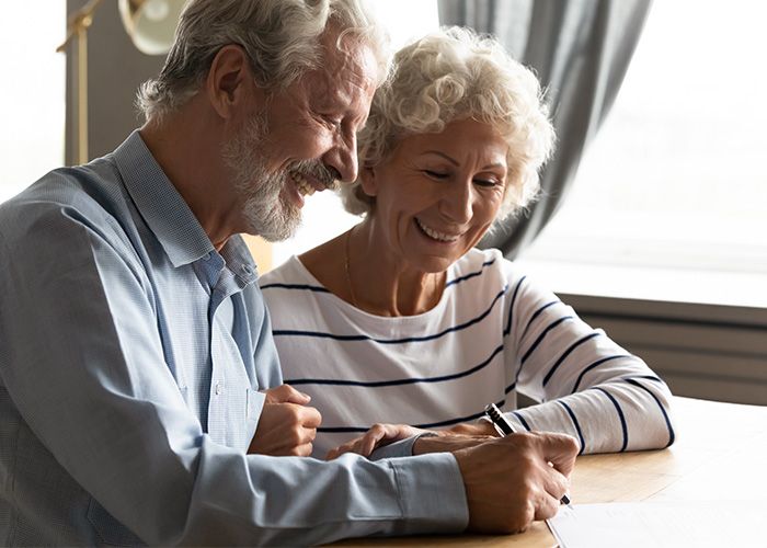 elderly couple writing will