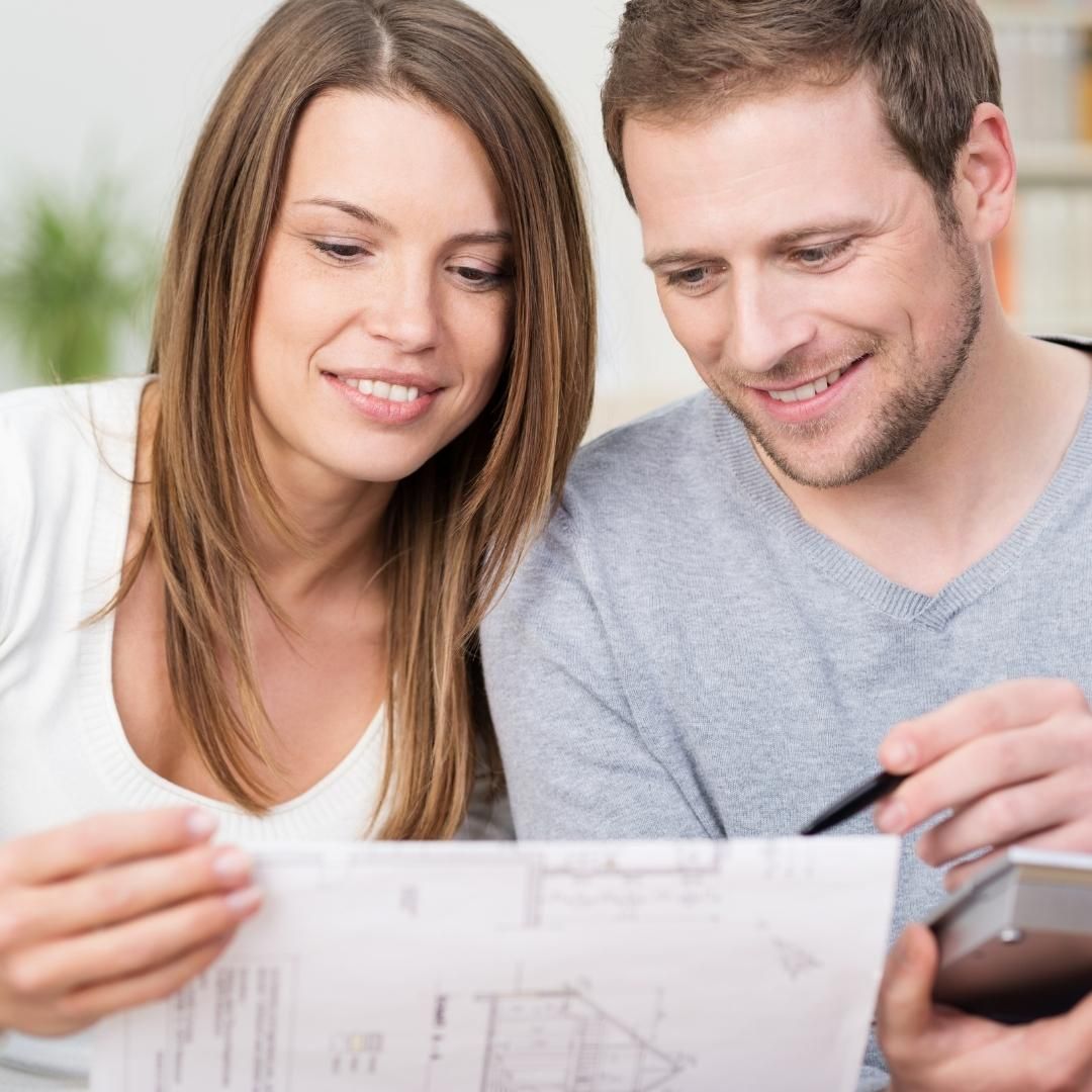 Image of a couple looking at blueprints