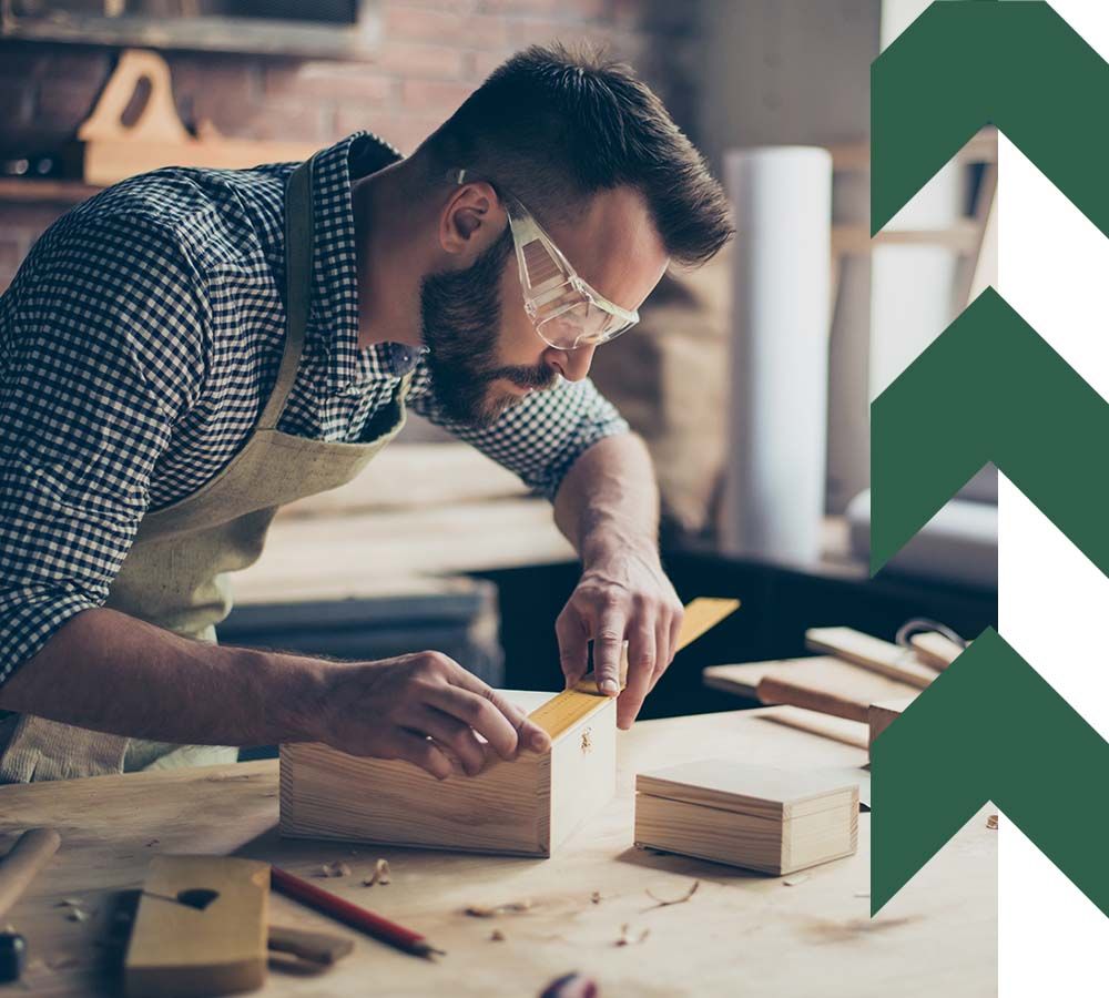 casual woodworker constructing wooden boxes