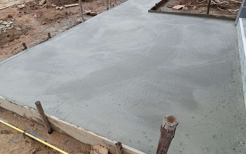 New concrete floor after poured cement at construction site