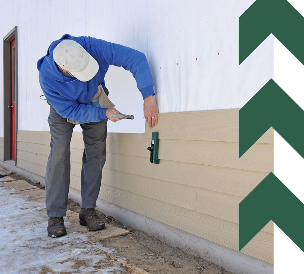  Man installing cement fiber siding using gauges