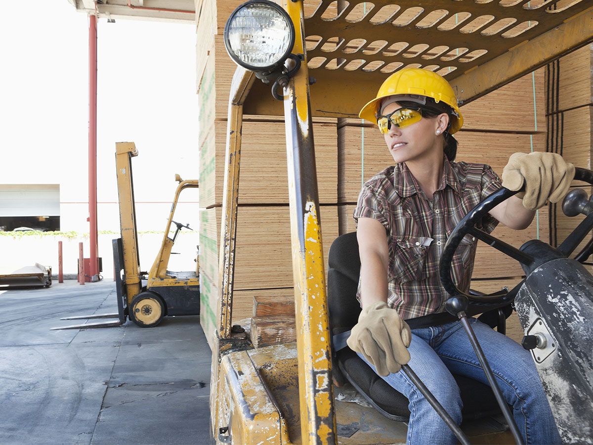 woman working in a lumber yard