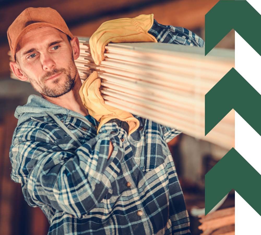 Lumber Contractor with Wooden Planks on His Shoulder.