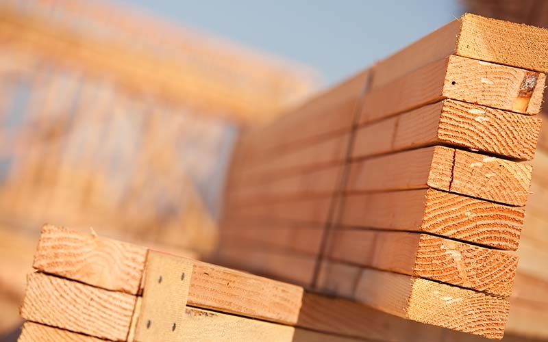 stack of lumber at construction site