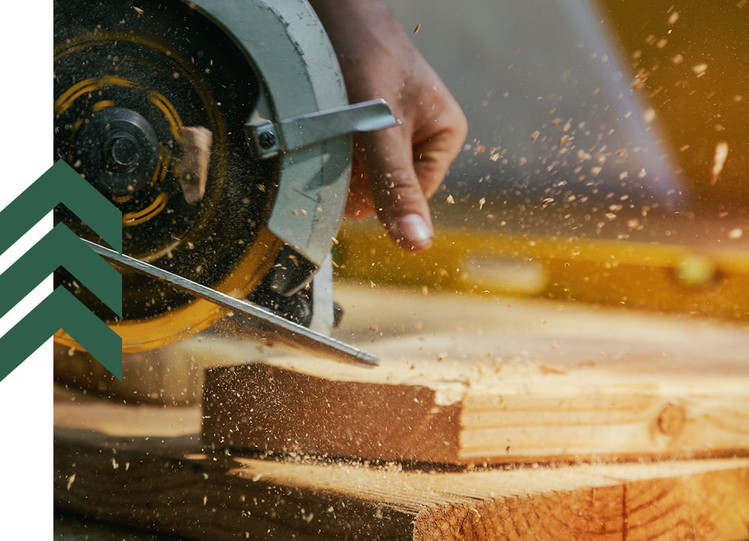 Person sawing lumber