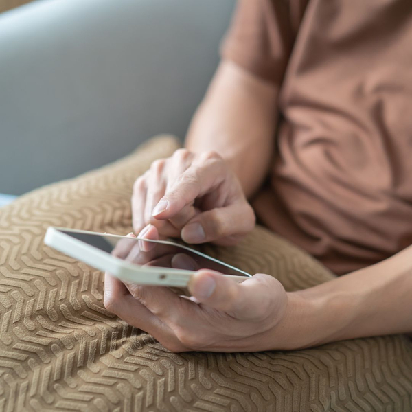 looking down at phone