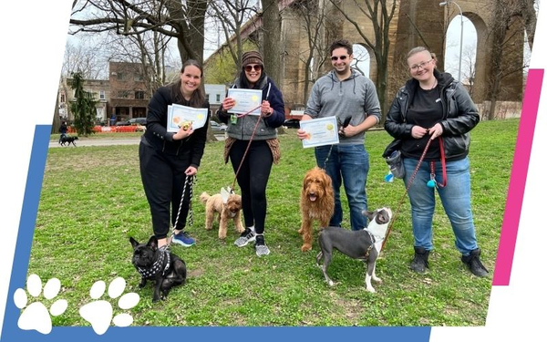 dog obedience school graduates with their owners holding certificates Dog training 3.jpg