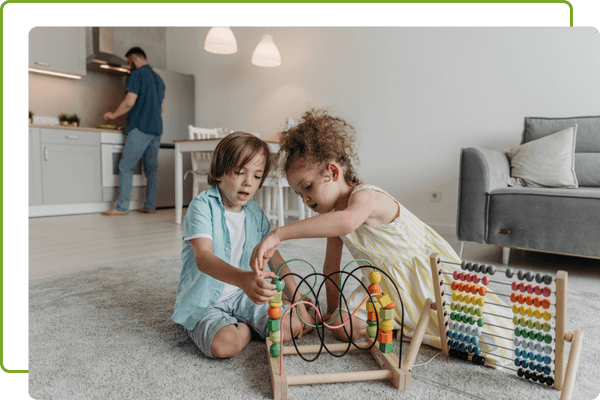 children playing while parent cooks