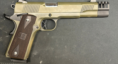 a brown and gold gun