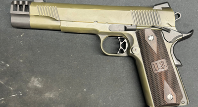 gold and brown gun