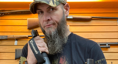 a man holding a gun part