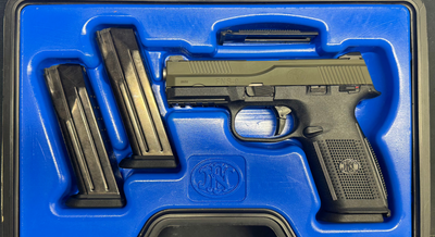 a gun and it's ammunition in a case