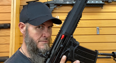 a man holding up a gun