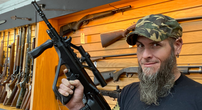 a man holding up a gun