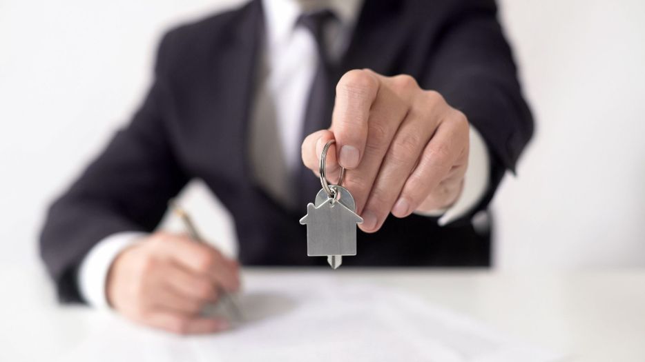 Realtor holds out house keys