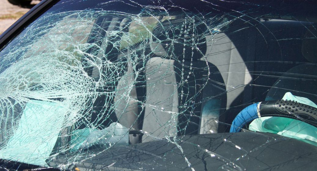 Broken car windshield. Broken car windshield.