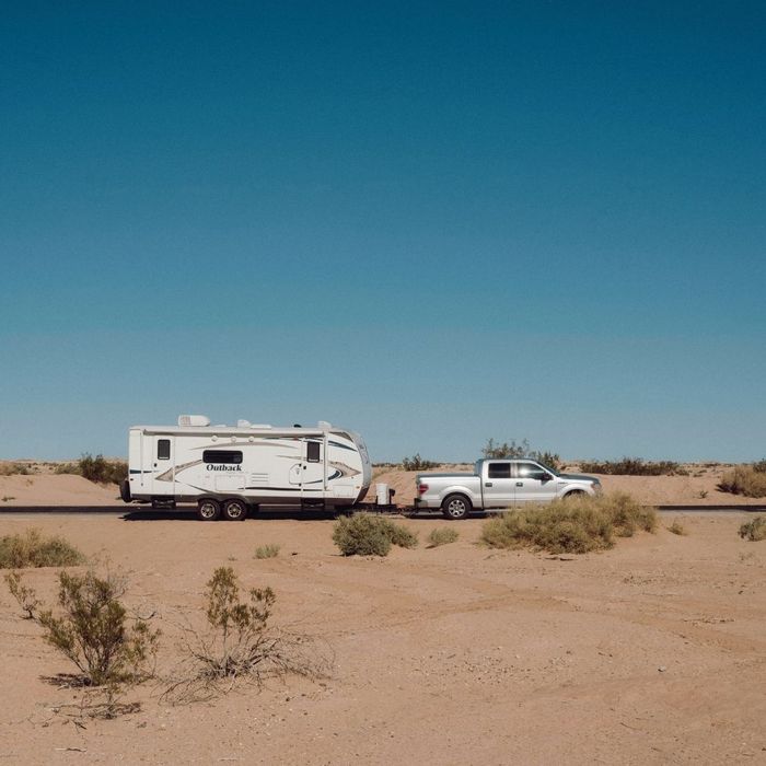 An RV driving in the desert.