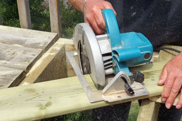 contractor cutting wood