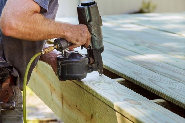 person working on a deck