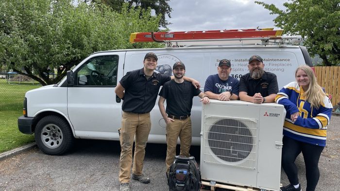 Beaver Heating & Air team with an AC unit