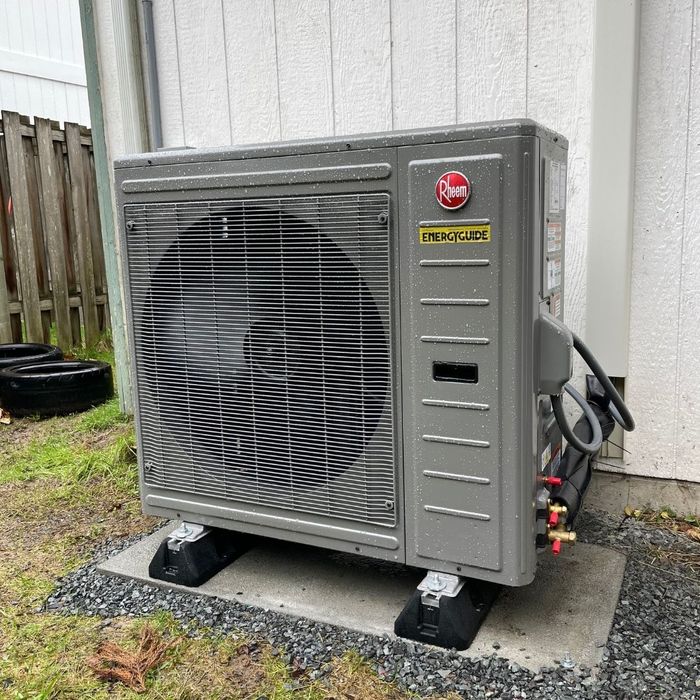 Image of a heatpump outside a house