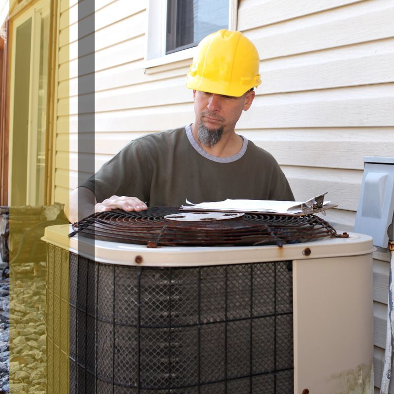 technician working on air conditioning unit