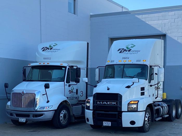 Two PLM Companies fleet trucks. 