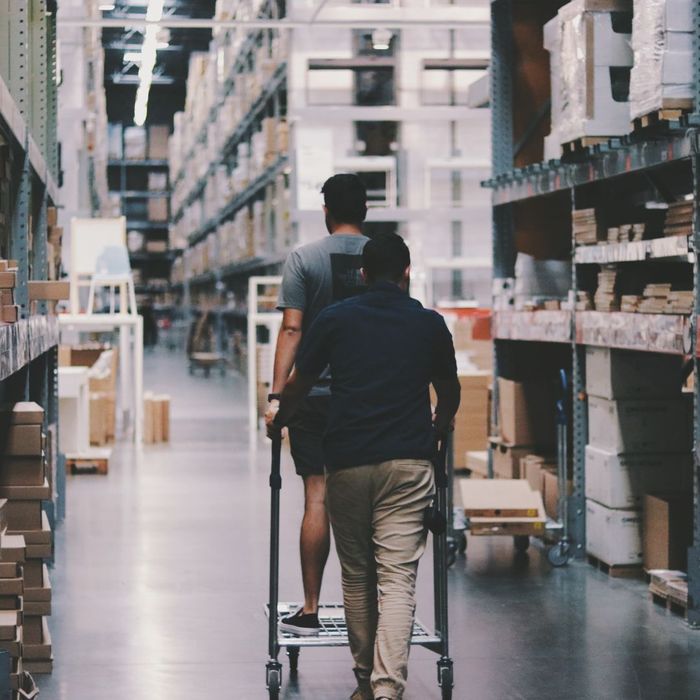 person pushing a cart in a warehouse