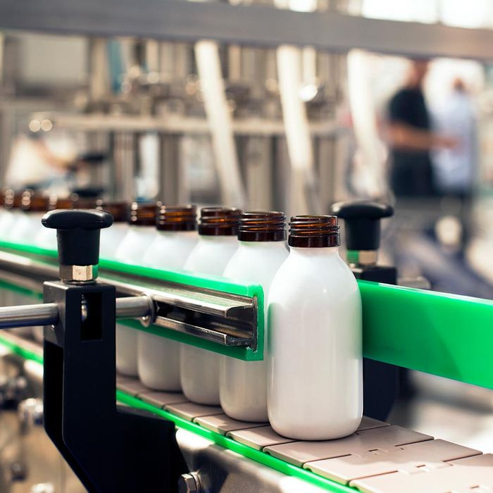 White bottles on a conveyor belt