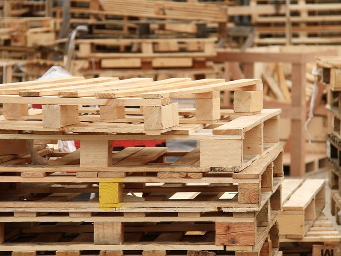 Wooden pallets stacked on top of each other.