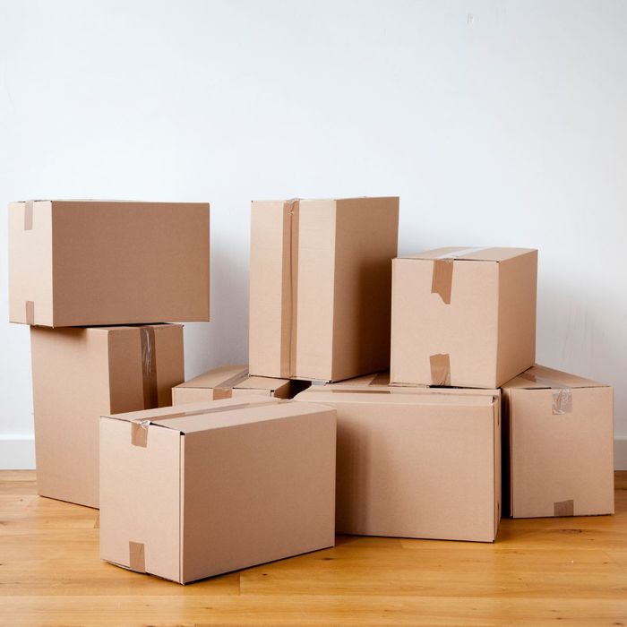 different sizes of boxes stacked on floor