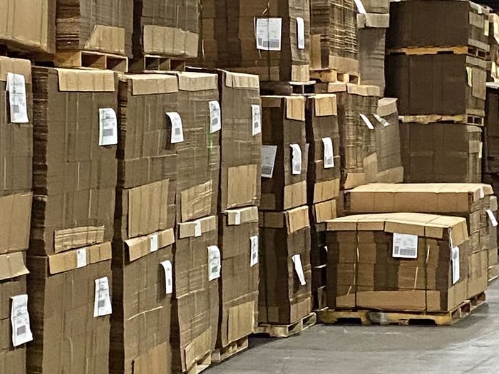 BUNDLES OF BOXES IN WAREHOUSE