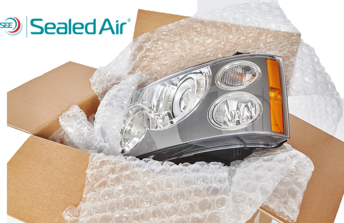 a box showing a car light in a box with bubble wrap around it