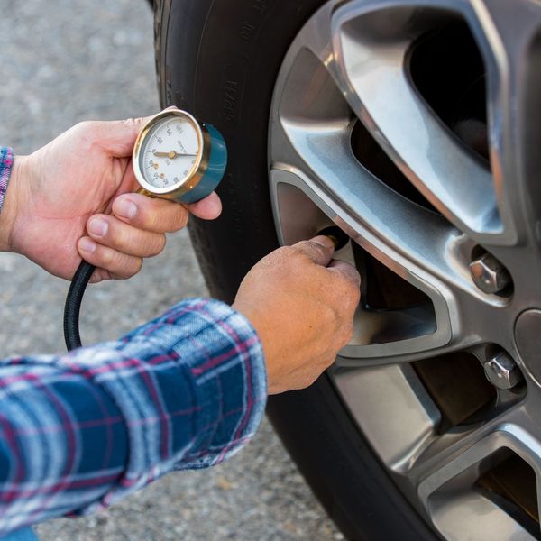 tire pressure being checked
