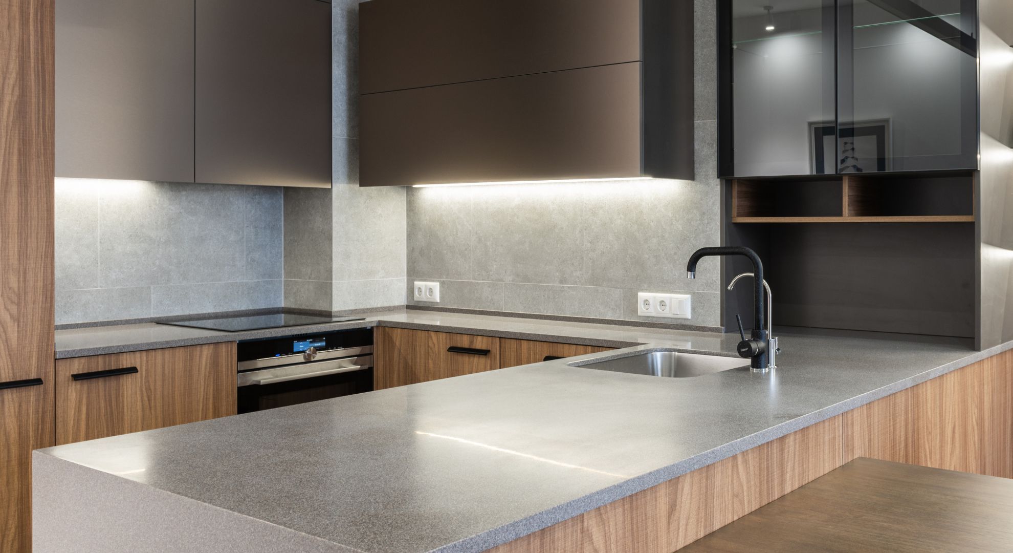 sleek metal and wood textures in kitchen, underlit cabinets