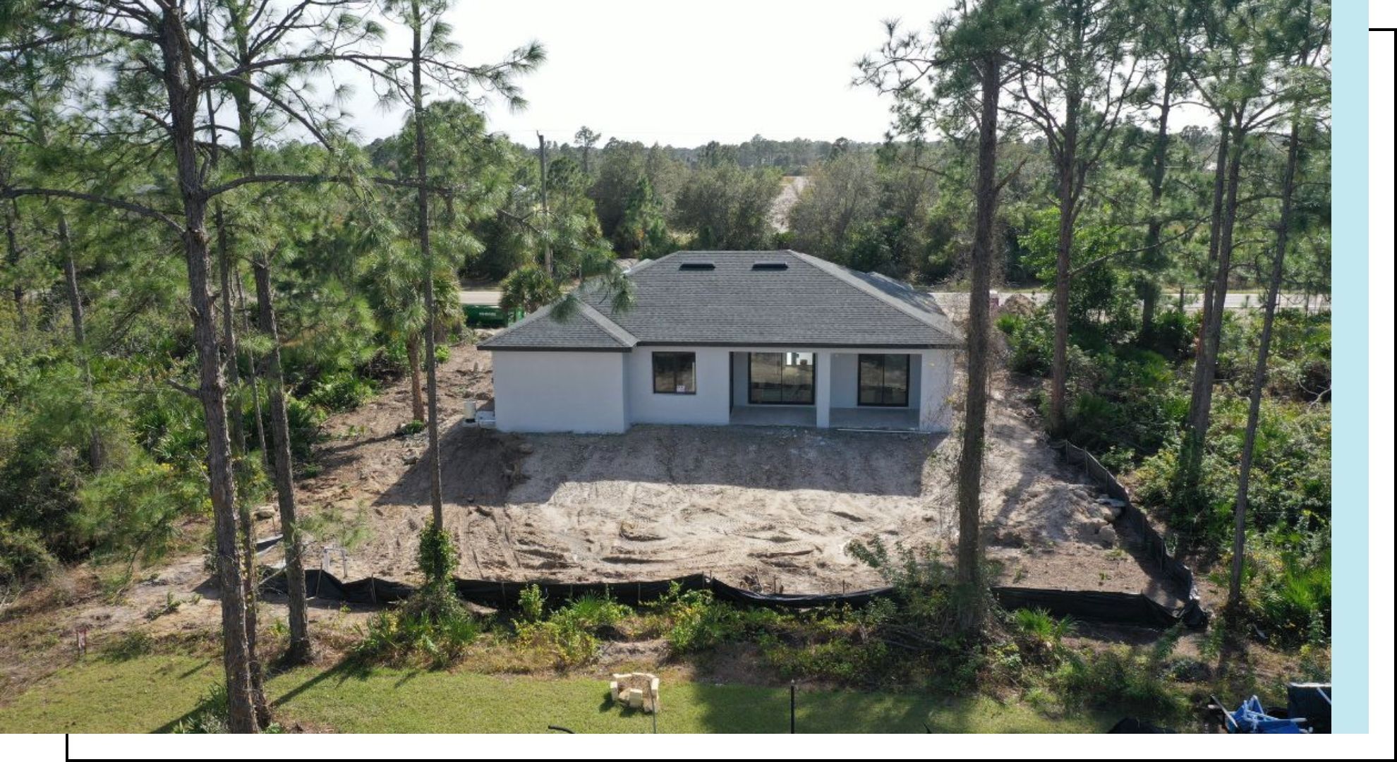 aerial view of new home on plot of land