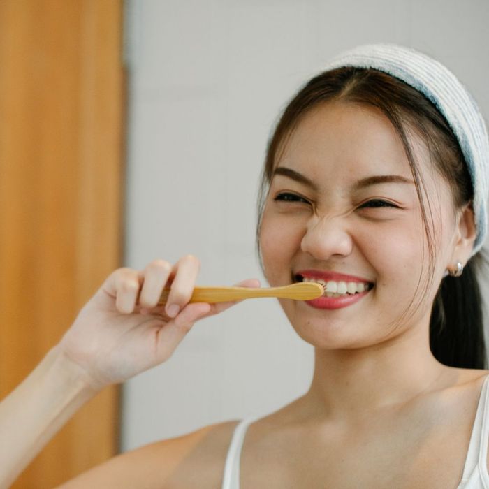 woman brushing her teeth