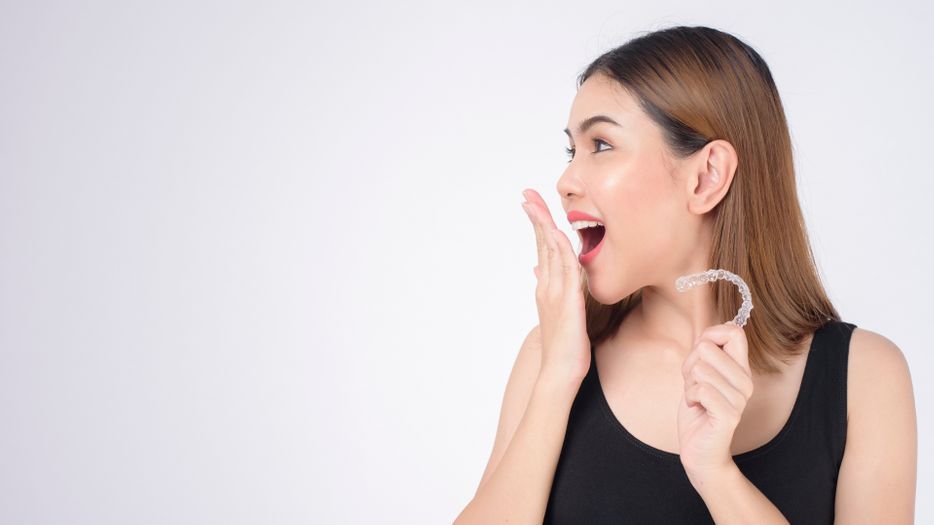 woman gasping with invisalign i nhand