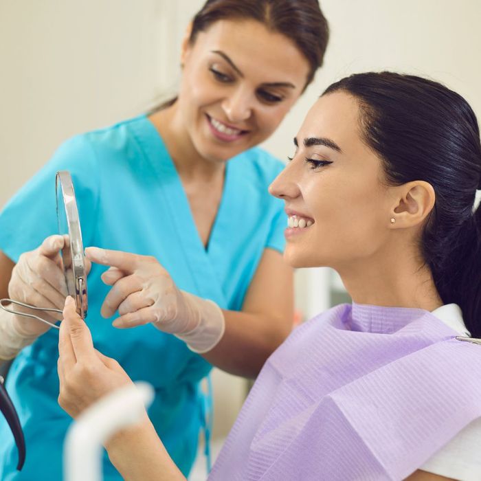 woman looking at teeth