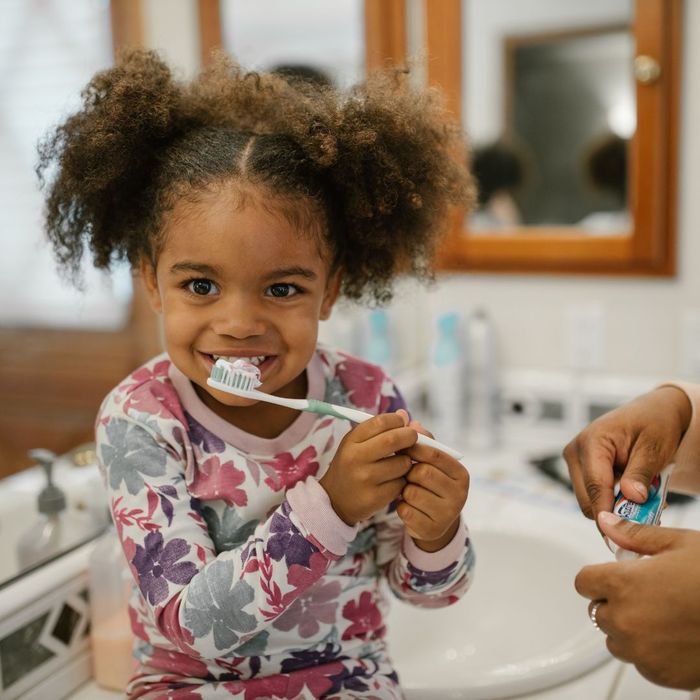 kid brushing teeth