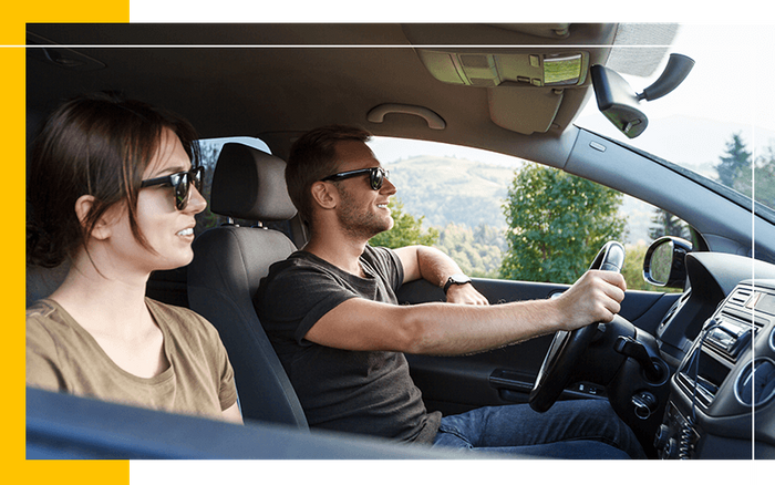 image of people driving a car