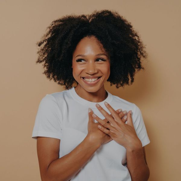 Happy women grabbing her heart