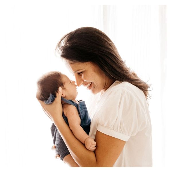 woman holding baby 