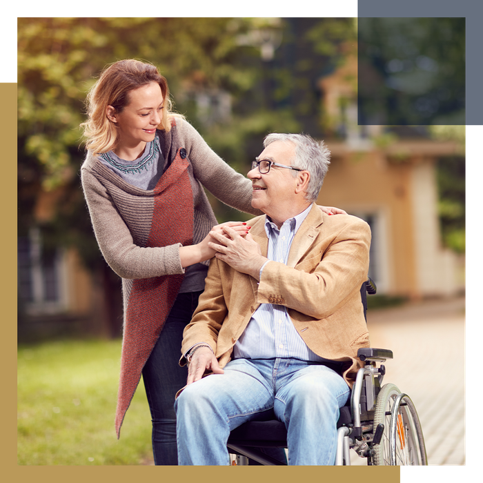 Caregiver accompanying a senior man on a walk