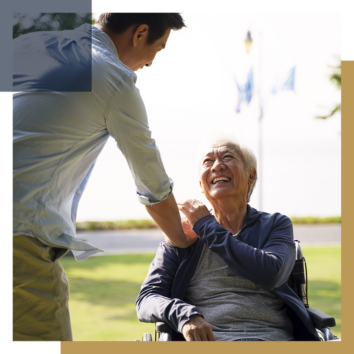 Caregiver accompanying a happy senior man